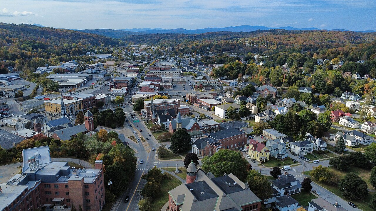 Barre from above in autumn, a grid of streets and roofs beneath the hills.