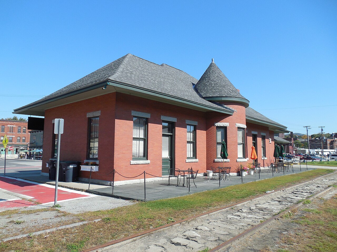 The Central Vermont passenger depot in Barre, a brick station with a turret beside the tracks.