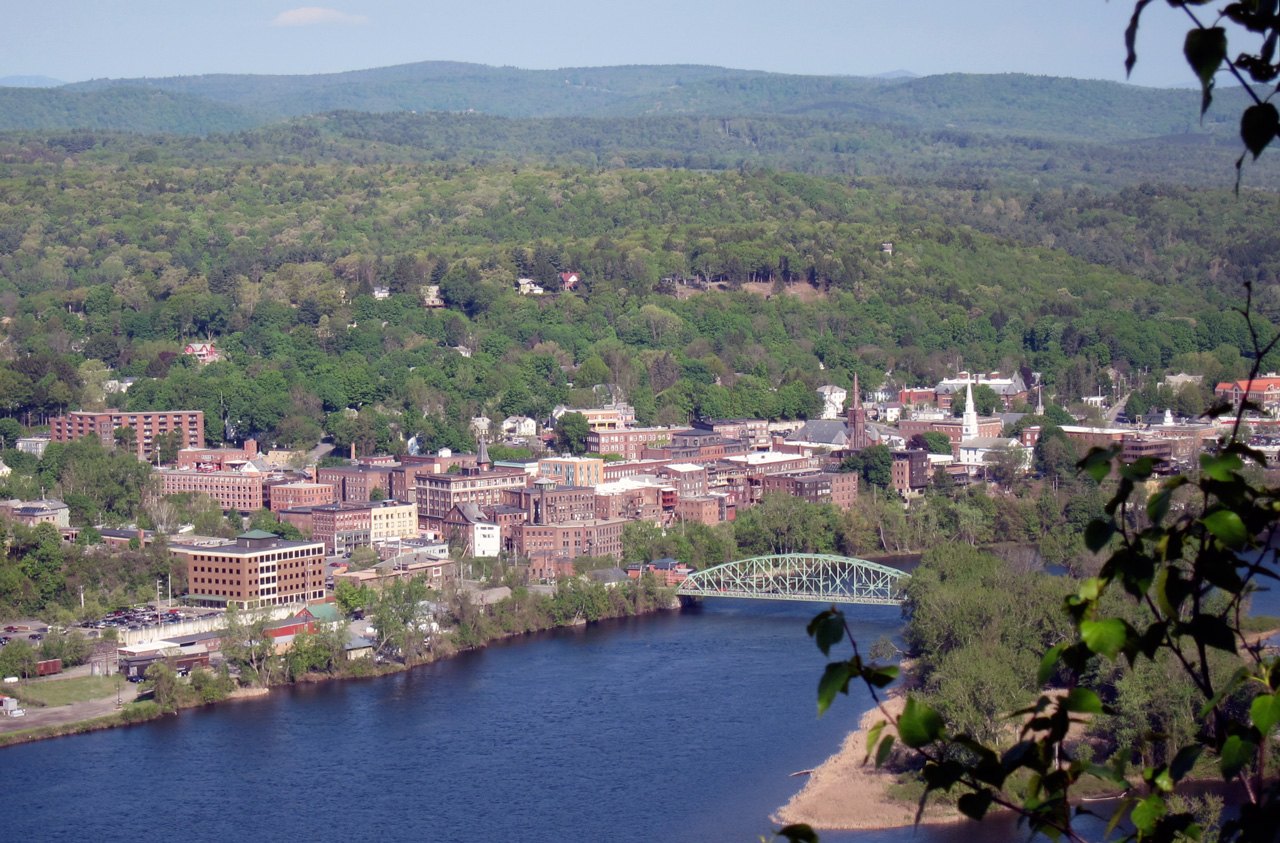 Brattleboro from a hillside above the Connecticut River, with the green bridge at the right.