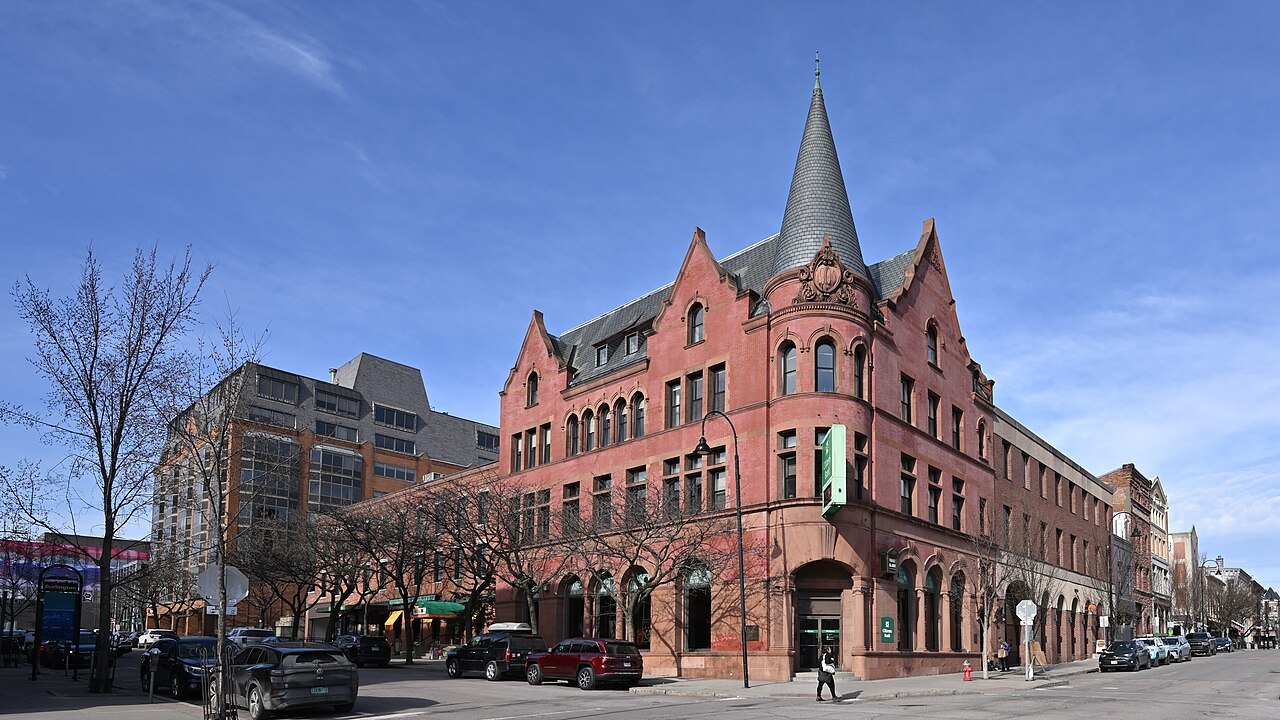 A Victorian brick block with a pointed tower on College Street in Burlington.