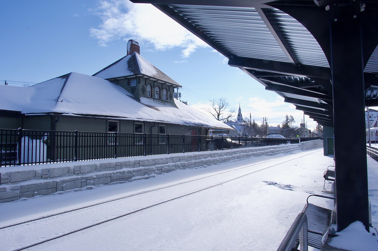 The Middlebury station in snow, a gabled depot with a canopy over the platform.