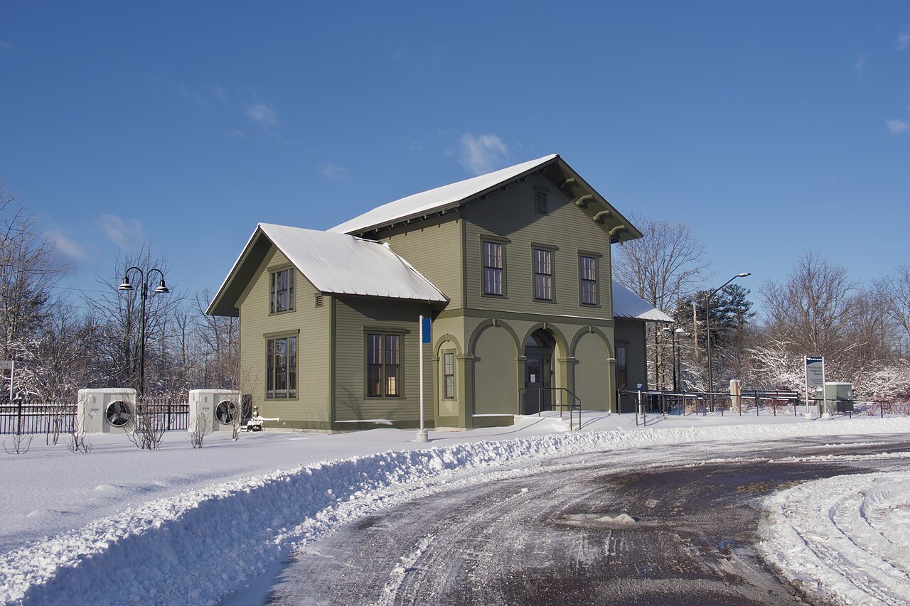 The Ferrisburgh–Vergennes station, a small yellow depot in snow.