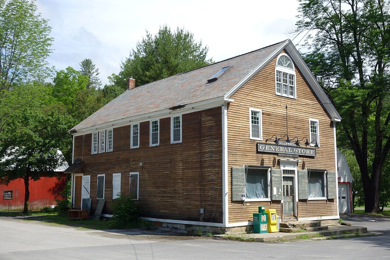 A brown clapboard general store in Williamsville with a gabled front.