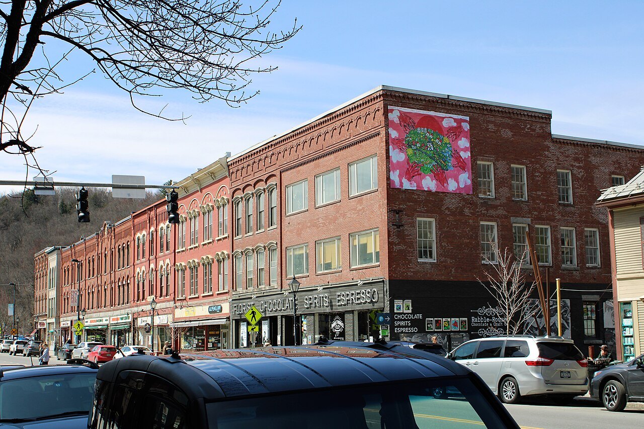 Main Street in Montpelier, a three-story brick block with a painted quilt square on its wall.