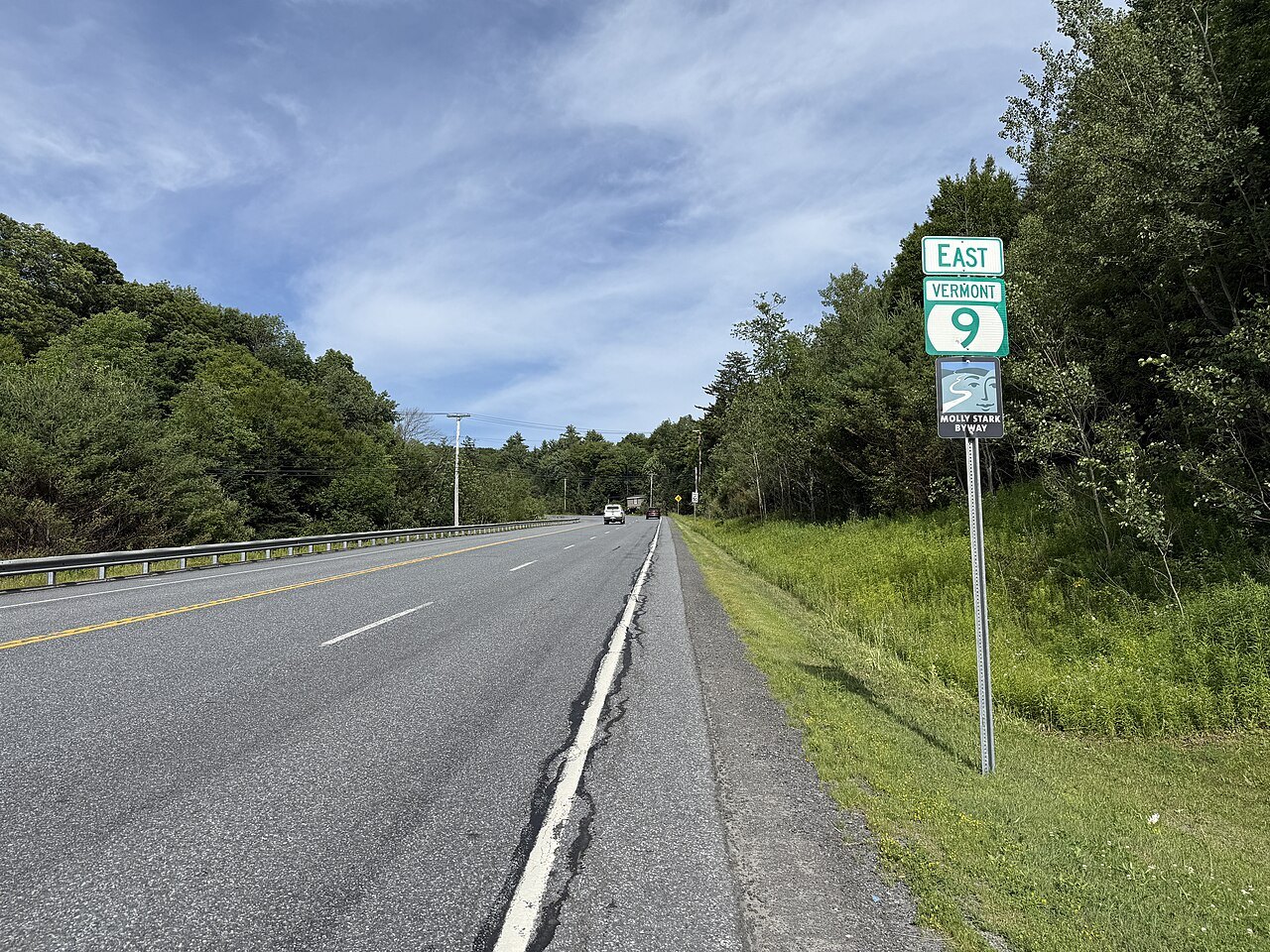 Vermont Route 9 eastbound past the Molly Stark State Park entrance, with a green route sign.