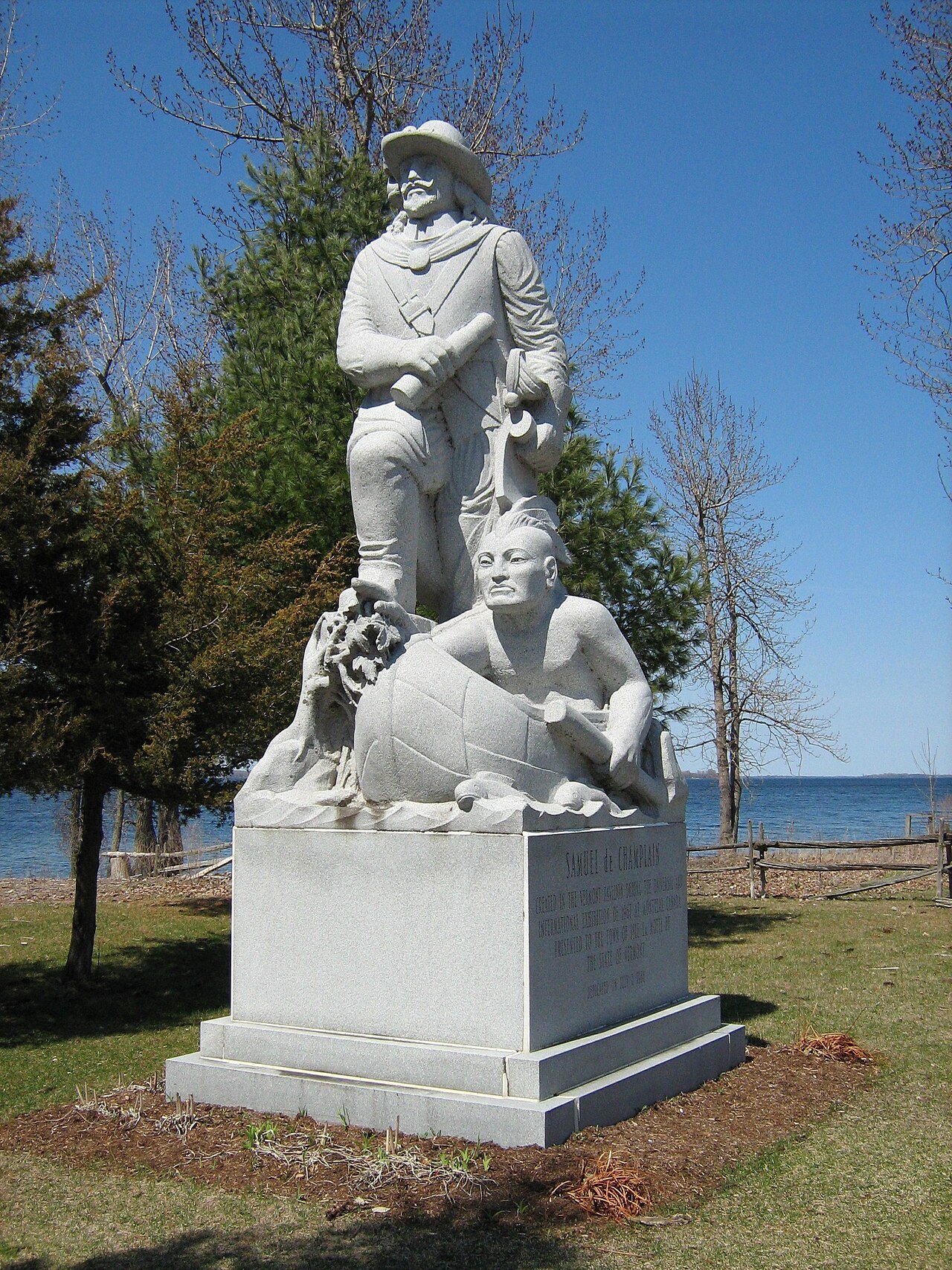 The statue of Samuel de Champlain at Saint Anne's Shrine, with the lake behind.