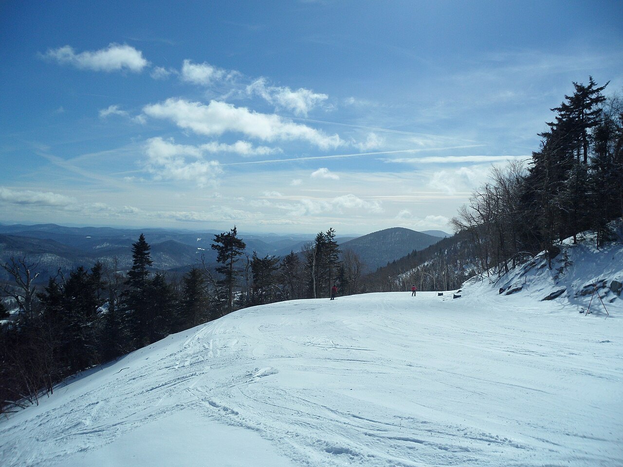 A groomed ski trail on Killington under a blue sky.