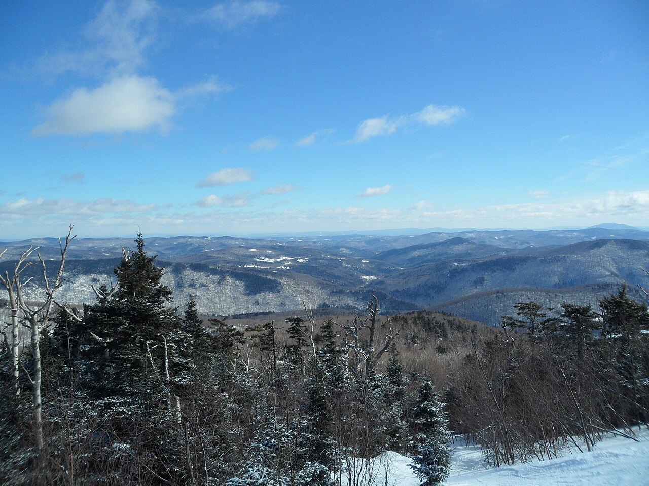 The view from Killington Peak across the Green Mountains, with ridges fading to the horizon.