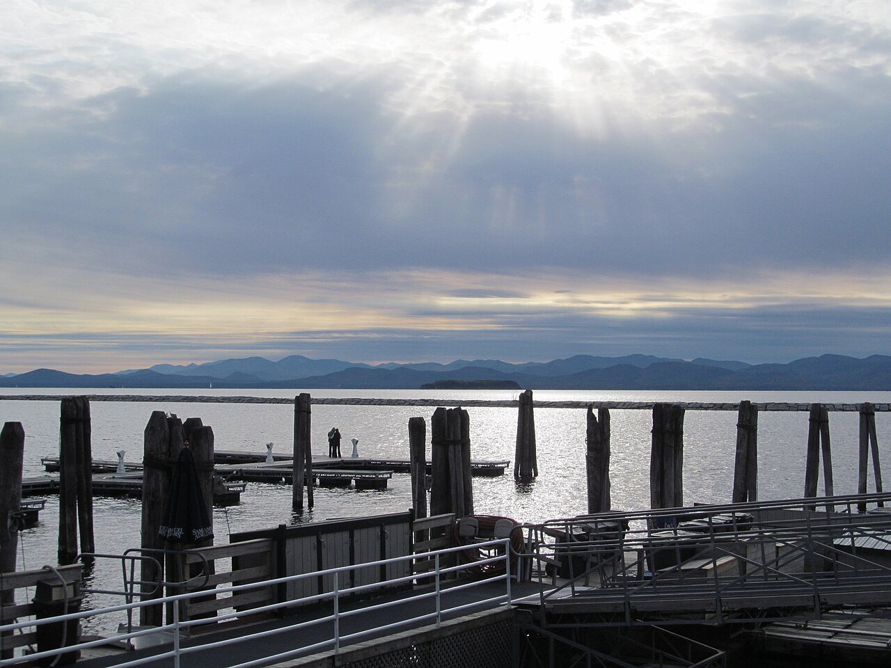 A ferry dock on Lake Champlain at Burlington, with the far shore faint in the distance.