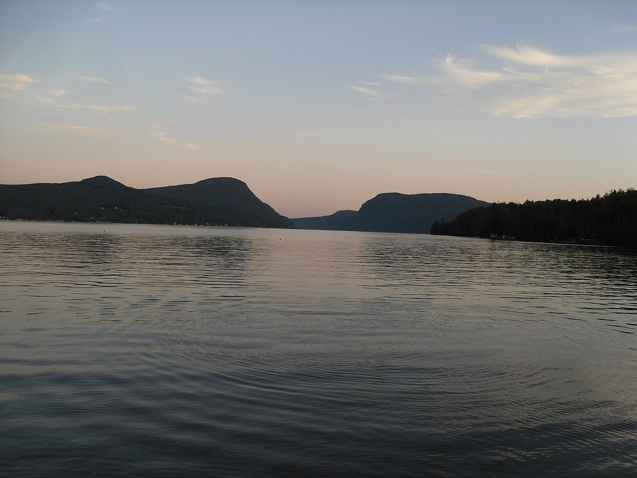 The gap between Pisgah and Hor at dusk, the lake still and pink.