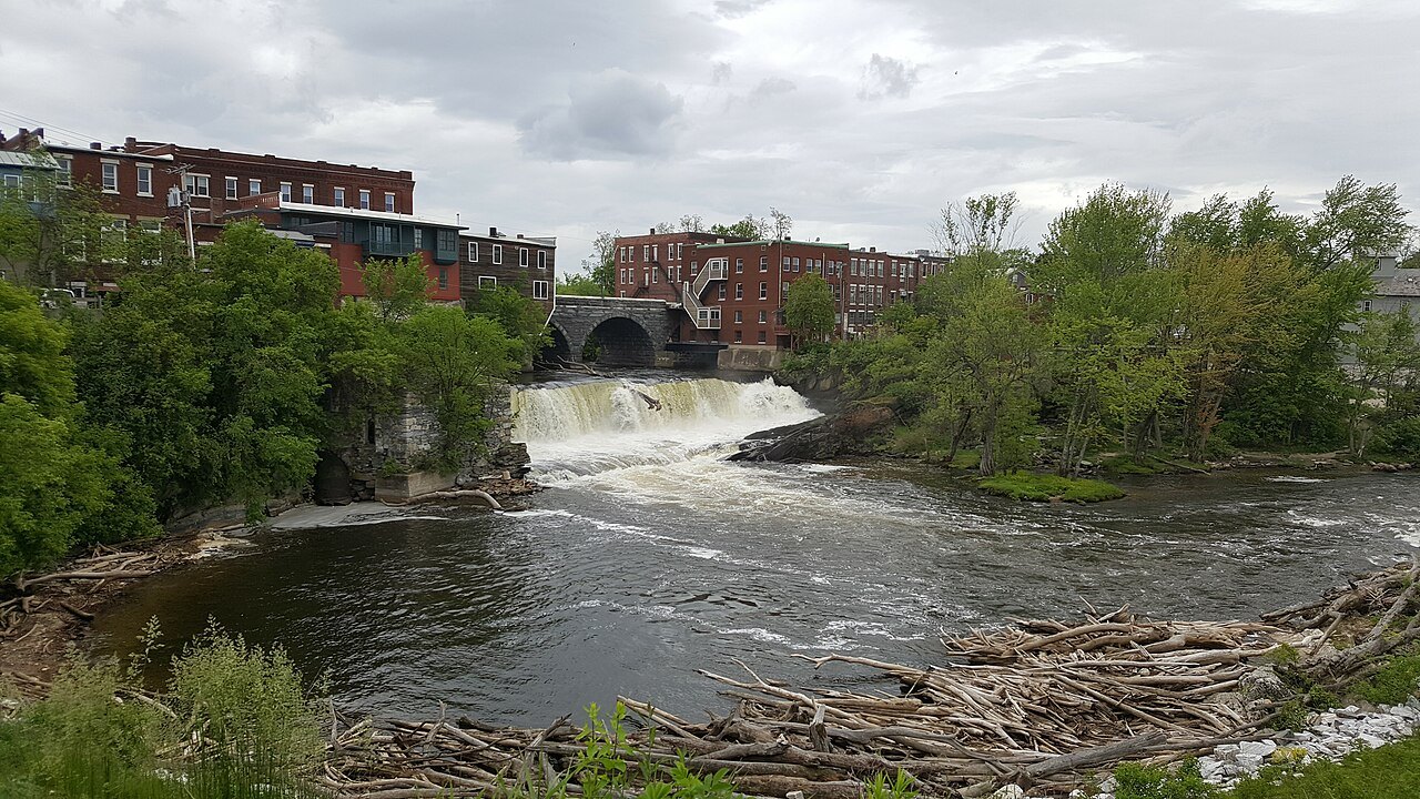 The falls of Otter Creek, with brick mill blocks above the water.