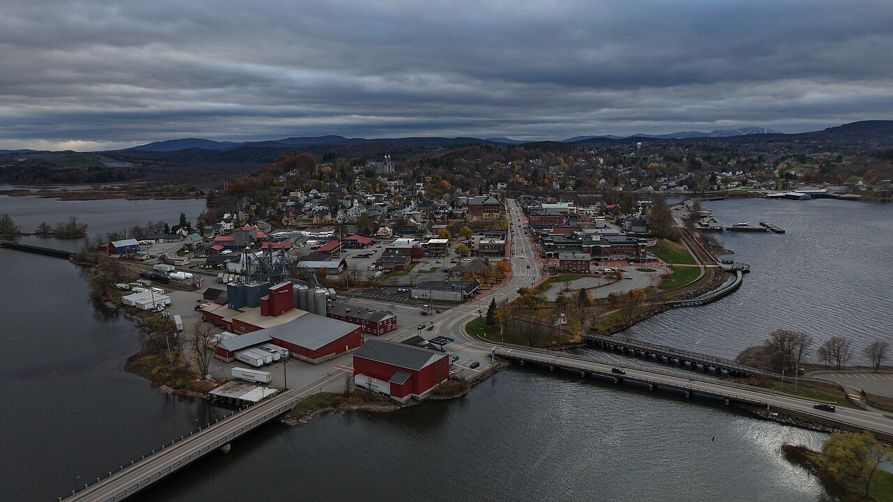 Newport's harbor and the causeway from above, under heavy cloud.