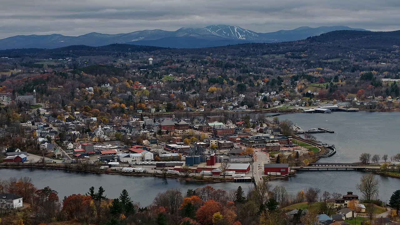 Newport from above in autumn, the town on its bay with distant ridges beyond.
