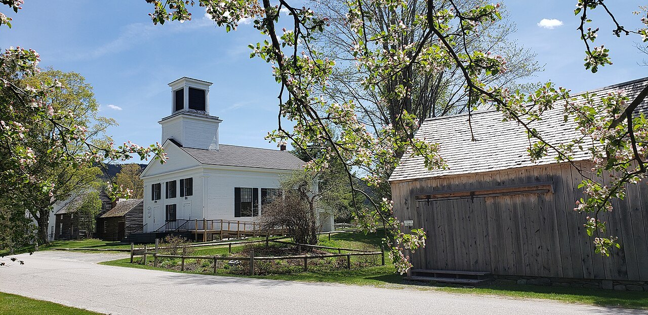 The village chapel in Plymouth Notch, a white building with a belfry, seen across the road.