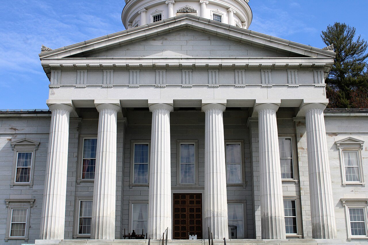 The Doric portico of the State House, six granite columns above the steps.